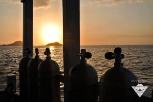 scuba tanks in sunset