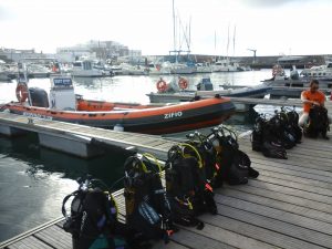 set up scuba kit next to boat